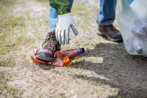 Crew member using PPE while handling commercial waste
